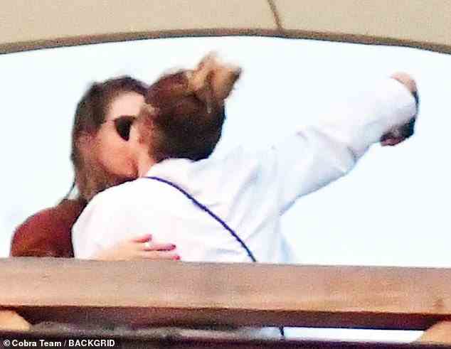 Close: Cara Delevingne was spotted posing for a very cosy snap with a friend in Venice on Monday as she enjoyed a short break in the Italian city