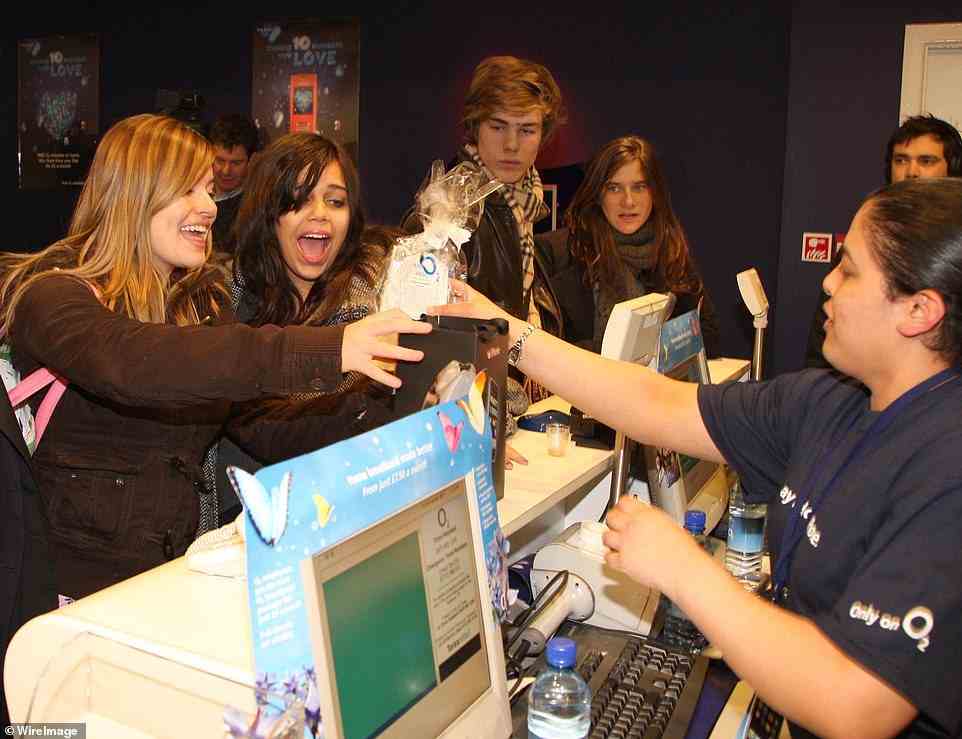 The first iPhone's release in other countries, including the UK, came in November. Pictured are the first customers to purchase the iPhone at the launch of the iPhone at the O2 flagship store in Oxford Street, London on November 9, 2007