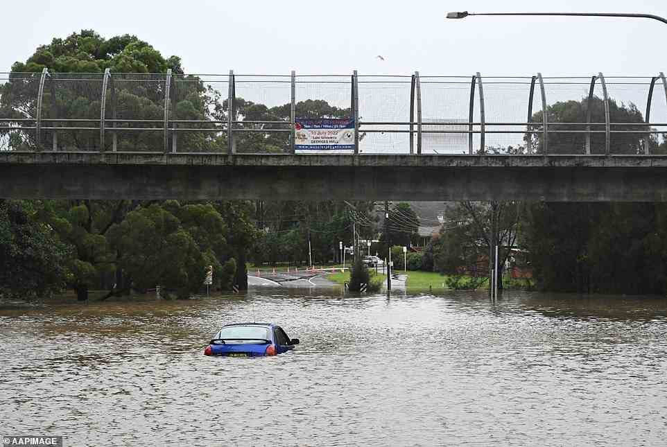 Daily rainfall in some areas has exceeded their averages for July (pictured, floods in Camden)