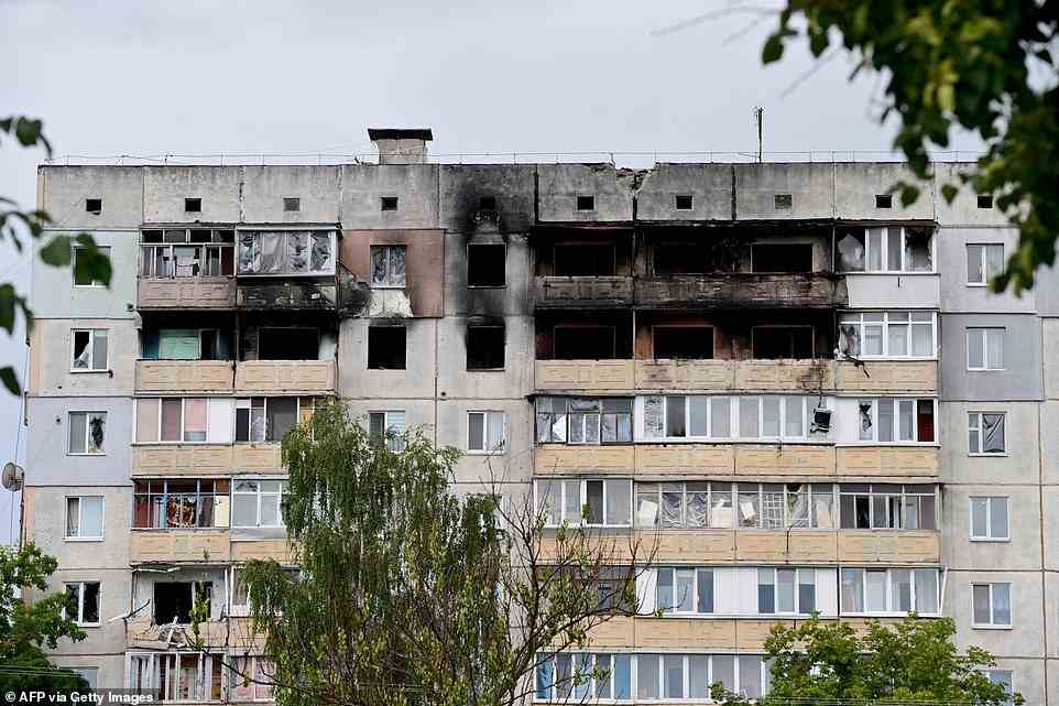 A destroyed building is seen in a residential area near Irpin, on Vokzalnaya street, which links the Ukrainian cities of Bucha and Irpin