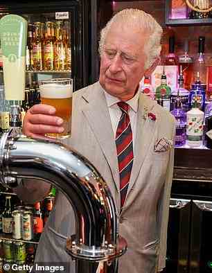 The Prince of Wales samples some beer at The Lion pub