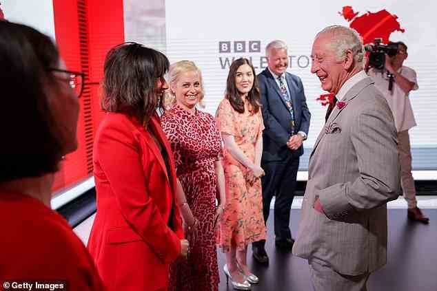 The beaming Prince of Wales meets members of the Wales Today team during his visit today