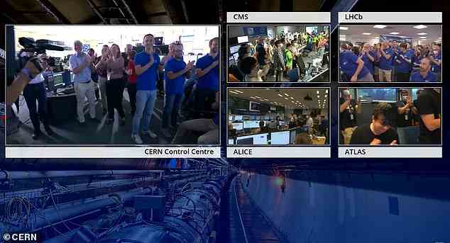 Während seiner Abschaltung wurden der Large Hadron Collider und alle seine begleitenden Detektoren umfassend aufgerüstet.  Oben abgebildet feiern Wissenschaftler den Start von Lauf drei
