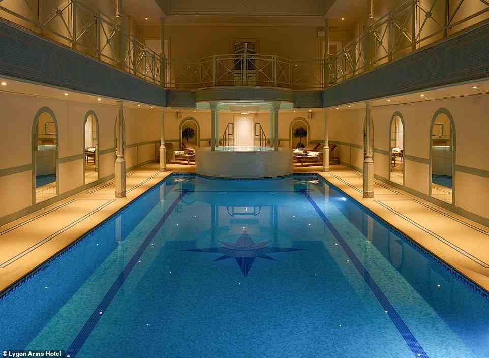 A room for two at Lygon Arms Hotel costs from £215 per night. Above is the hotel's pool