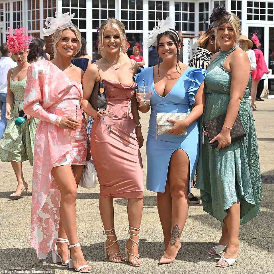 Here come the girls! Another group sipped on their drinks as they posed for a photograph before the races began this afternoon