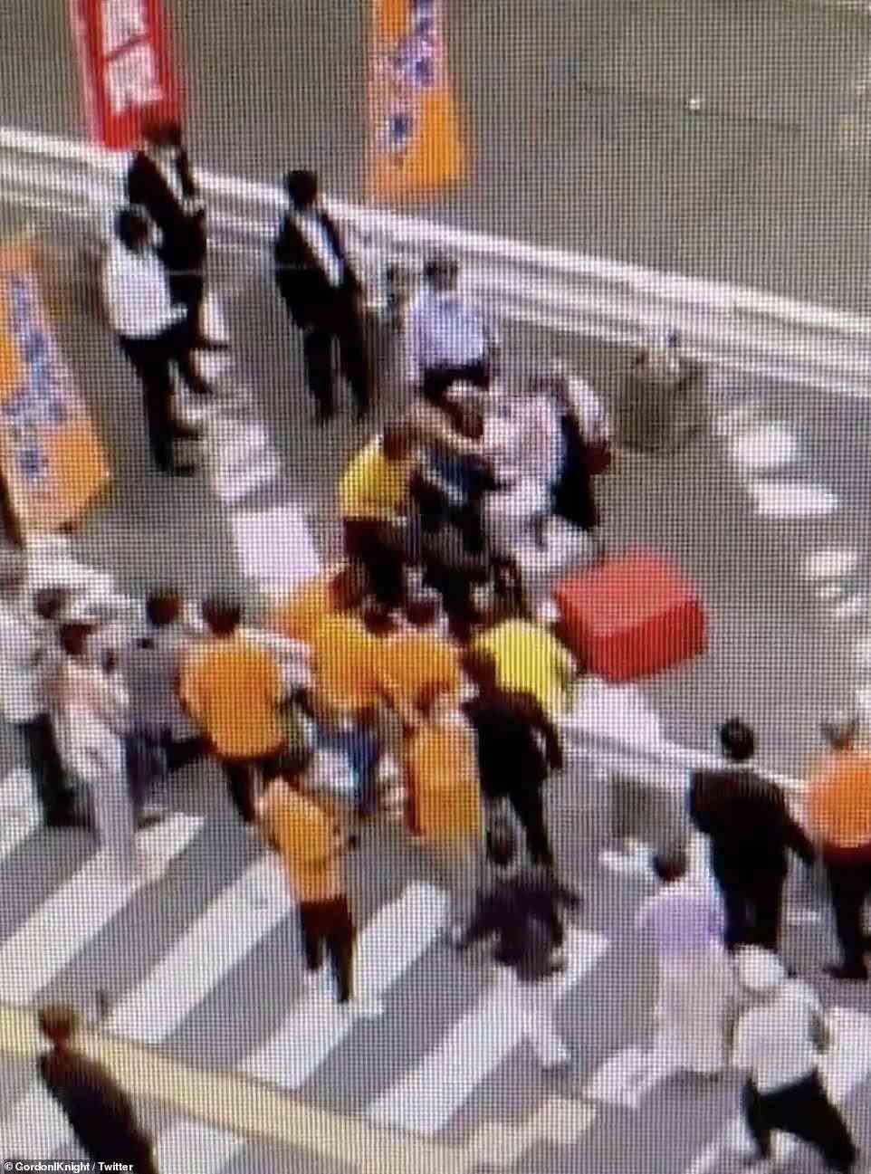 Surveillance footage from above shows security staff rushing to assist the politician after the shocking shooting on Friday