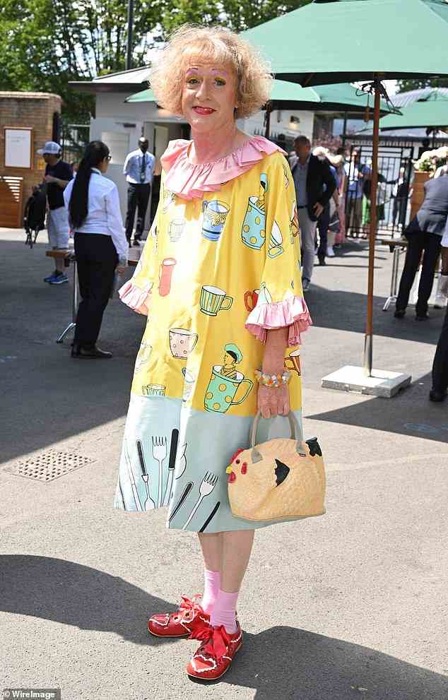 Unique: Grayson Perry rocked a quirky yellow and blue patterned dress and carried a chicken handbag with him