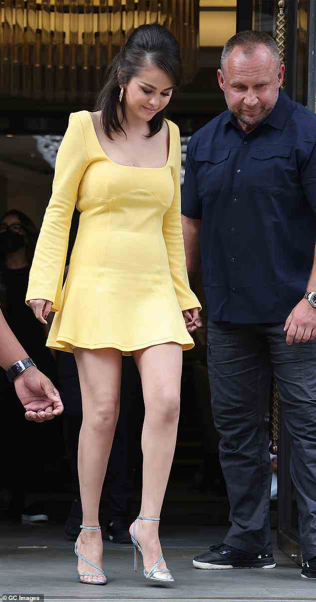 Stunning: The American actress, 29, looked effortlessly chic in a dusty yellow mini dress with flared sleeves
