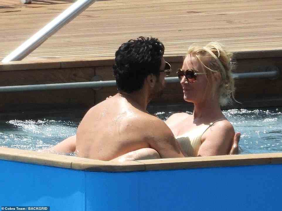 The couple gazed into each other's eyes as they frolicked in the hot tub together