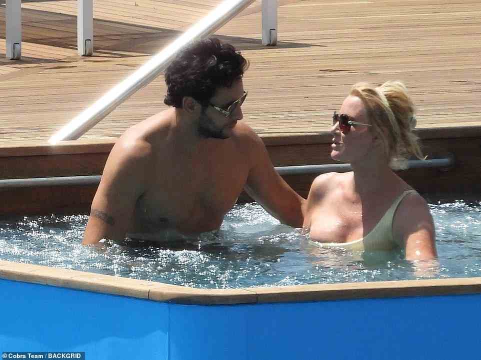 The couple couldn't keep their hands off each other when they hopped into the hot tub