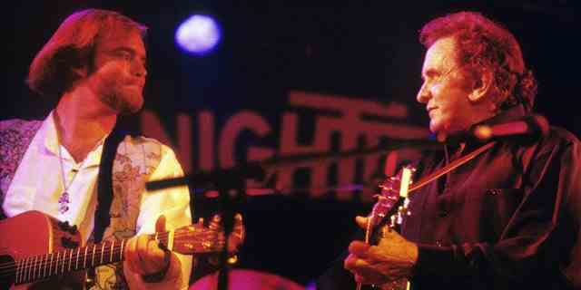 Johnny Cash performs on stage with his son John Carter Cash (L) in Rotterdam, Netherlands, circa 1994.