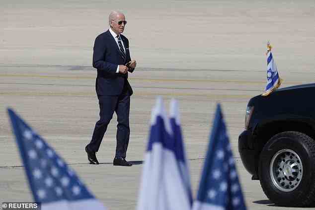 President Joe Biden, wearing his trademark aviators, walks across the tarmac of the Ben Gurion Airport outside of Tel Aviv, in advance of his historic flight to Jeddah, Saudi Arabia