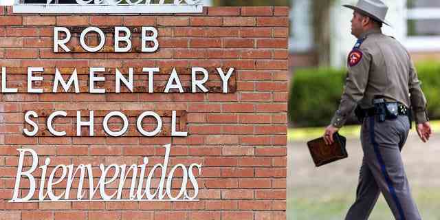 Ein State Trooper geht am Schild der Robb Elementary School in Uvalde, Texas, vorbei.