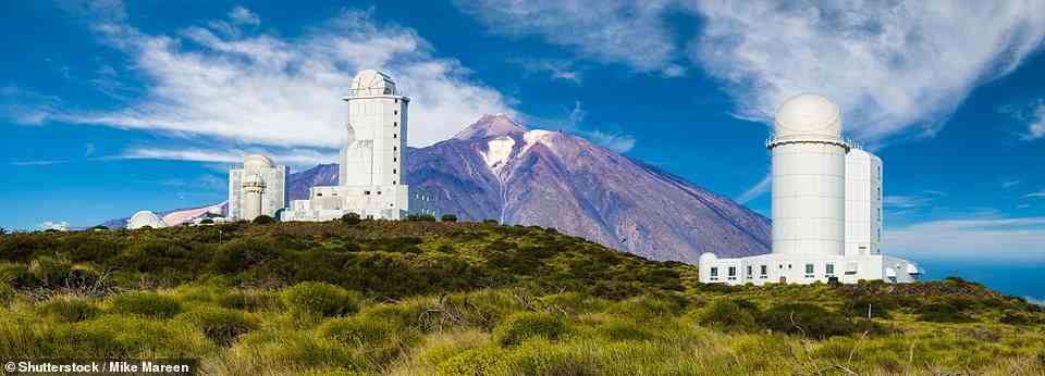 'We headed towards the shining white buildings and telescopes of Mount Teide’s astronomical observatory at Izana (above),' writes Carlton