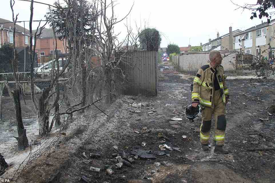 South Yorkshire firefighters in Maltby after a fire started on scrubland before spreading to outbuildings, fences and homes