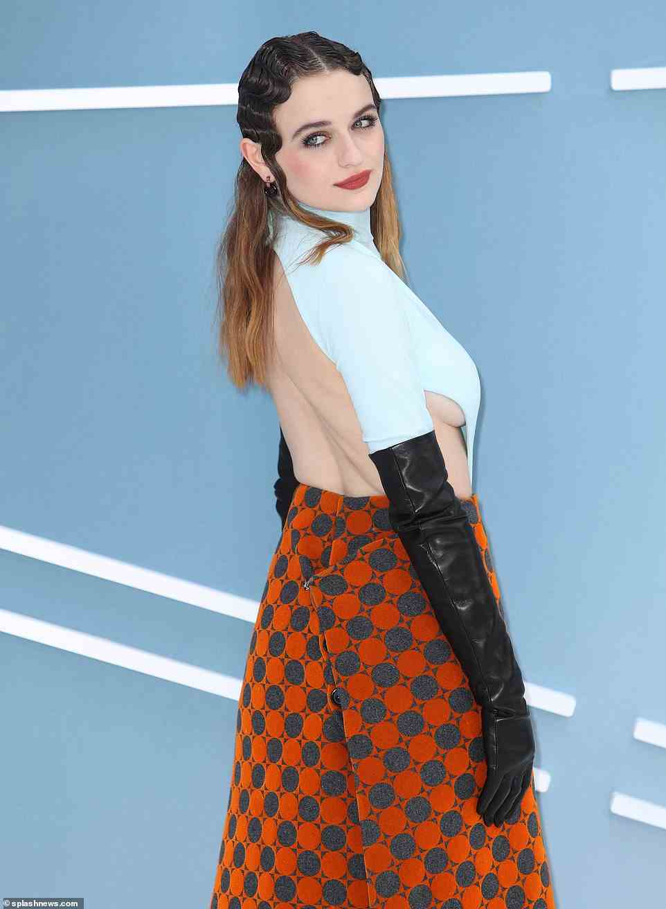 Sizzling: Joey set pulses racing in the edgy fitted top which she teamed with leather gloves and a 70s-inspired skirt as she posed on the white carpet at Cineworld in Leicester Square