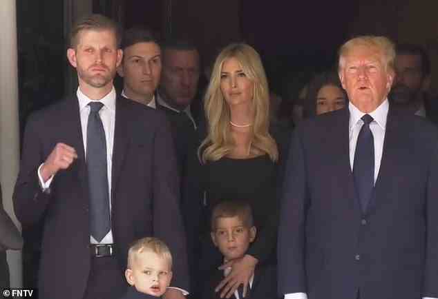 Although his face remained grieving, Eric Trump discreetly raised his fist as he rested his other hand on his four-year-old son's shoulder at his mother's funeral
