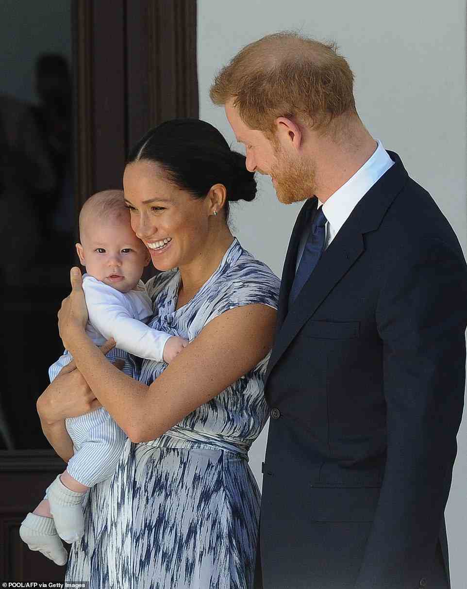 Duke and Duchess of Sussex, Prince Harry and his wife Meghan hold their baby son Archie as they meet with Archbishop Desmond Tutu and his wife (unseen) at the Tutu Legacy Foundation in Cape Town on September 25, 2019