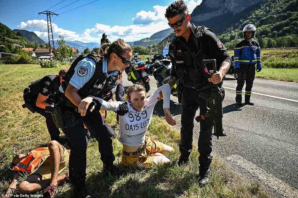 The activists sat on the road some 36 kilometres (22 miles) from the finish in Megeve on July 12 before they were removed by police