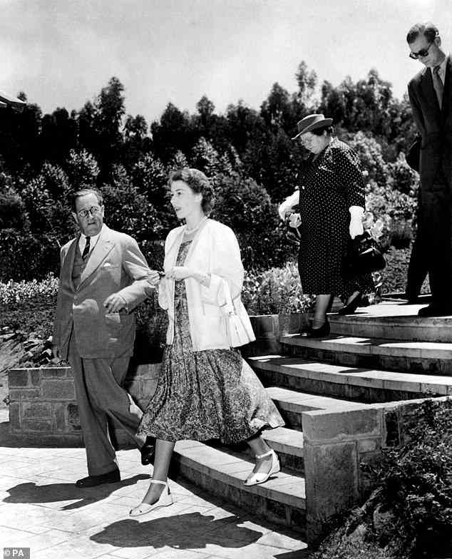 Princess Elizabeth and the Duke of Edinburgh (behind) arrive in Nairobi for their Commonwealth Tour in 1952, where Elizabeth receives the news of her father's death
