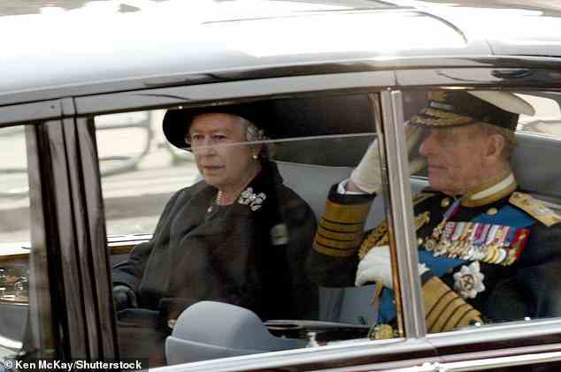 The Queen and the Duke of Edinburgh arrive at the funeral of the Queen Mother who passed away at the age of 101