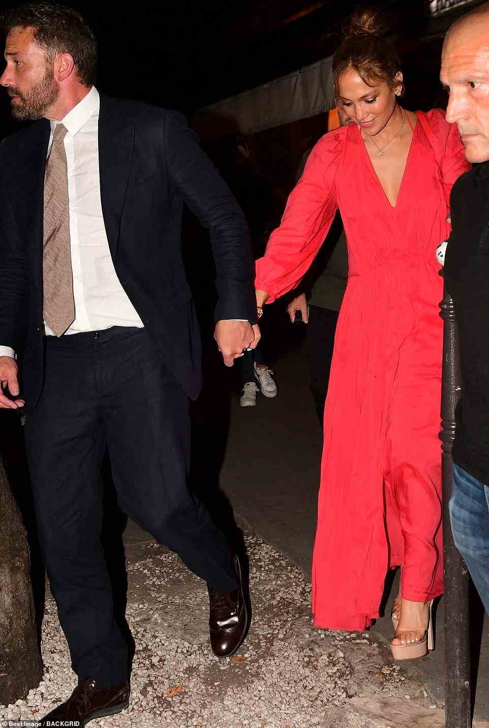 On July 21, the first day of their honeymoon, the actress donned a Forte Forte red dress, which retails for $775. She paired the look with nude Andrea Wazen Antingone PVC platform heels, which cost $620