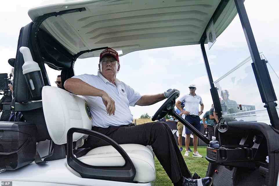 Former President Donald Trump sits in his golf cart during the pro-am round of the Bedminster Invitational LIV Golf tournament in Bedminster, N.J., Thursday, July 28, 2022