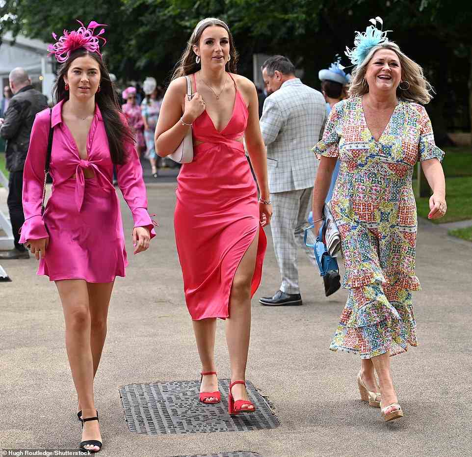 Glamorous revellers donned fabulous headpieces and vibrant frocks as they descended on Newmarket racecourse for Ladies Day today