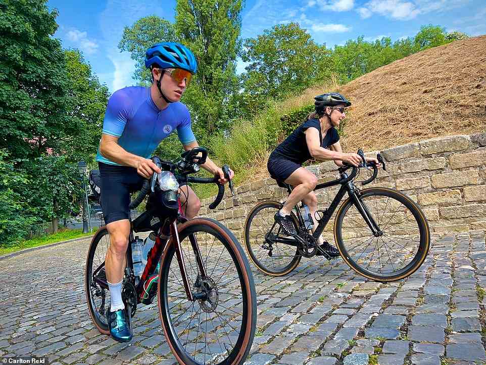 Carlton's son, Josh, and wife, Jude, climbing the fabled Muur climb in Geraardsbergen during their Belgian cycling odyssey