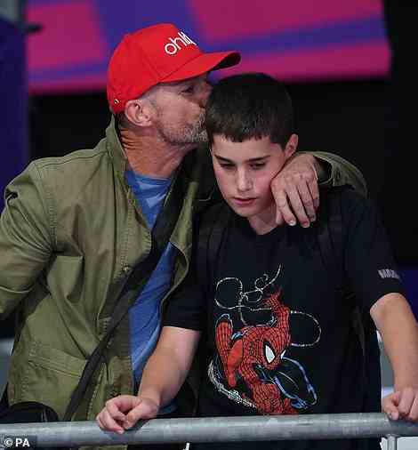 Family affair: Fred took his son Lucien to the games as he showed his support for older sister Andrea