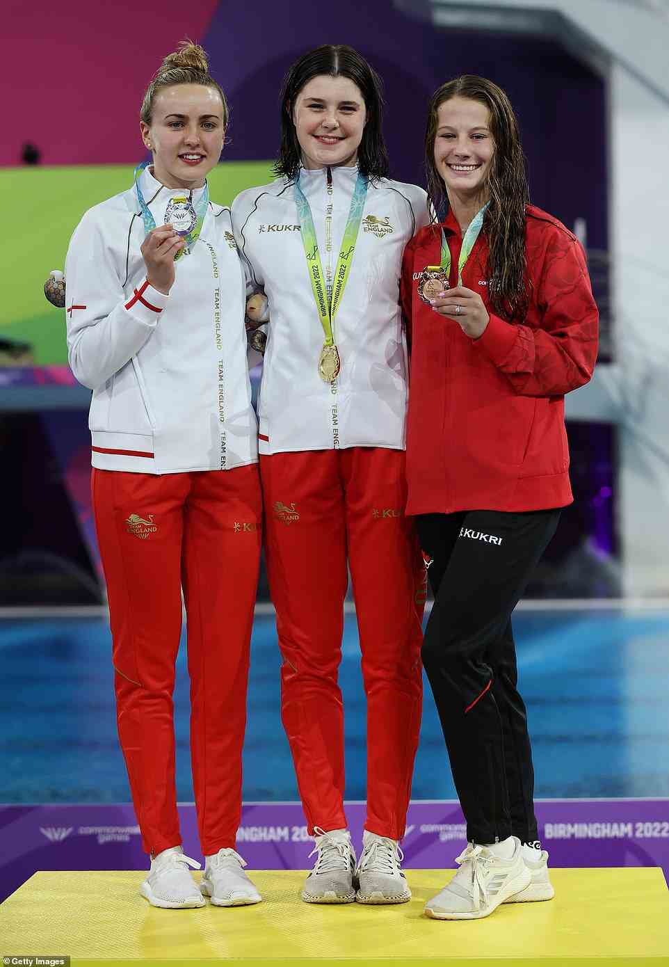 Well done: Andrea was joined by silver medallist and teammate Lois and Canadian bronze medallist Caeli Sierra McKay as they posed with their medals