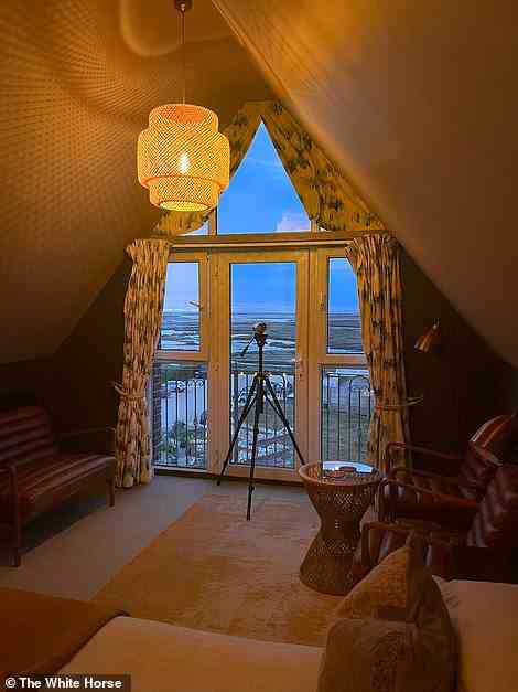The ‘Room at the Top’ guest room, pictured, has its own viewing telescope
