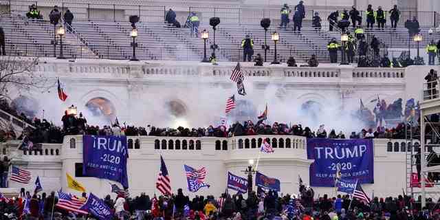 Violent insurrectionists loyal to President Donald Trump, storm the Capitol, Jan. 6, 2021, in Washington.