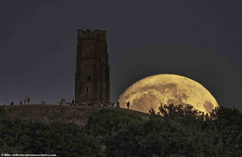 Pictured is the moon rising behind Glastonbury Tor in Somerset on Wednesday evening (August 10). The moon was at 96 per cent illumination on Wednesday night. When it reaches 100 per cent illumination on Thursday night it will be a full moon. The moon will also be a supermoon tonight, because it marks the point in the orbit of the moon at which it is nearest to the Earth