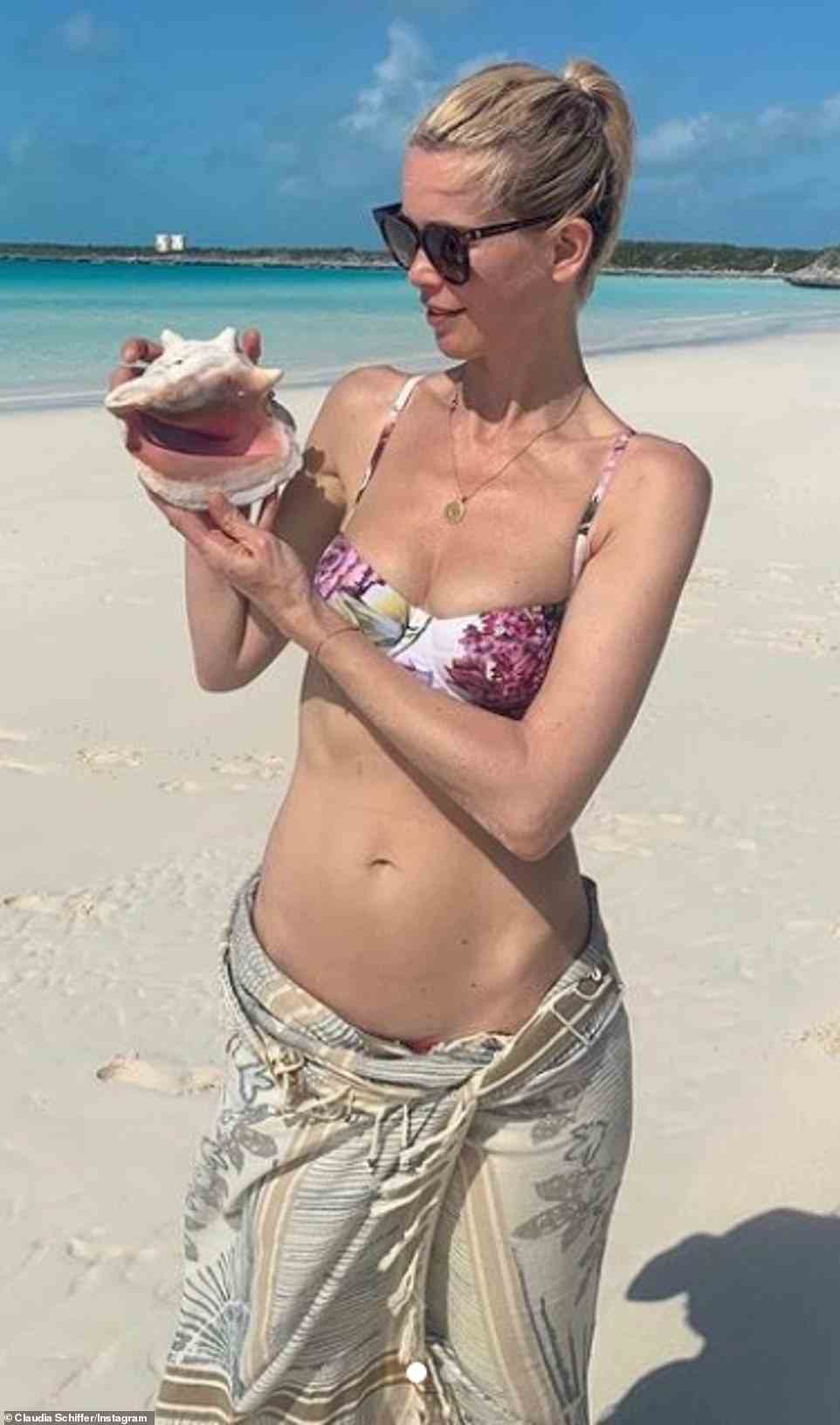 Claudia Schiffer, 51, proved she still had it when she shared a few photos in a floral bikini back in June. The sexy snaps showed her standing on a tropical beach in a white a pink flowered bathing suit, while holding a shell