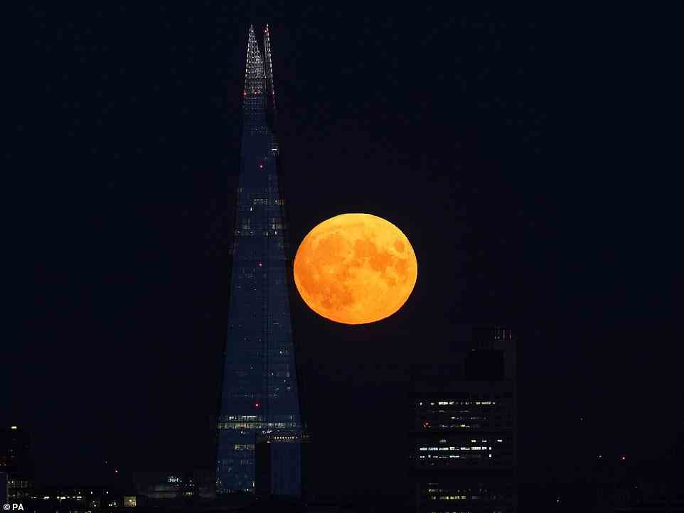 The Sturgeon supermoon, which is the final supermoon of the year, rises behind The Shard in London on Thursday August 11