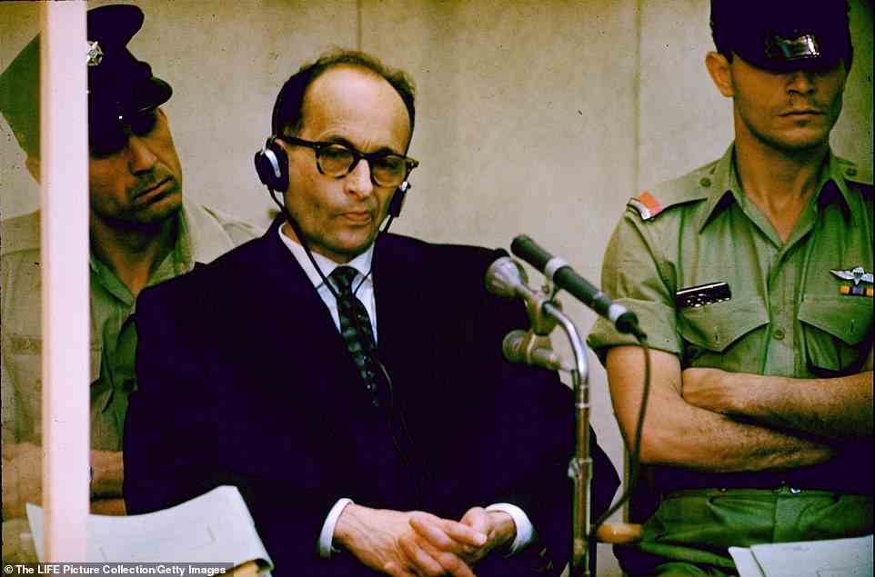 The only recognisable figure in Nolan's Holocaust paintings is Adolf Eichmann, the architect of Hitler's 'Final Solution'. Eichmann is pictured at his 1961 war crimes trial in Israel