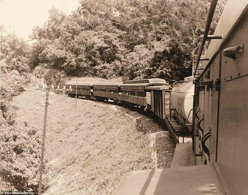A 'mixed train' in 1963 negotiating the mountainous section between Kingston and Montego Bay in Jamaica, photographed from the English Electric diesel engine at the front. The book adds: 'This was the island¿s main line, over 110 miles long and cut through solid rock in places. It connected the two largest cities and visited most of the island¿s other major towns en route'