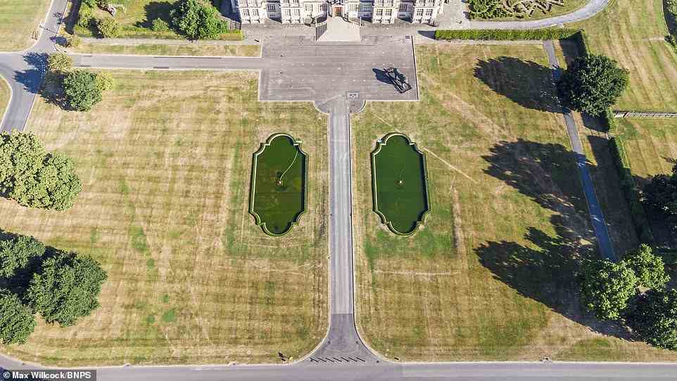 The 'ghost' garden at Longleat in Wiltshire shows up because the soil over the buried landscape features is shallower than its surrounding area