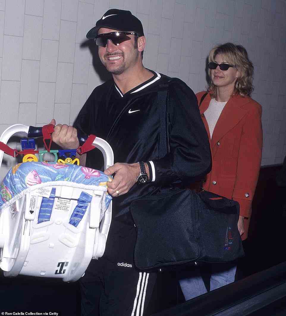 Newlyweds: Tim McGraw and Faith Hill tied the knot in 1996 and welcomed their first daughter Gracie the following year - pictured in 1997