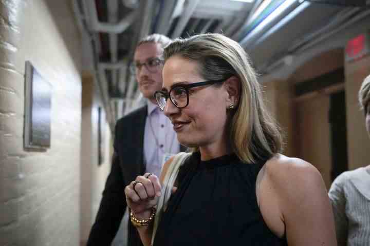 Razor-thin majorities meant every Democrat had leverage over the final bill. Sen. Kyrsten Sinema (D-Ariz.), shown here in July of 2022, used hers to push for a much weaker initiative.