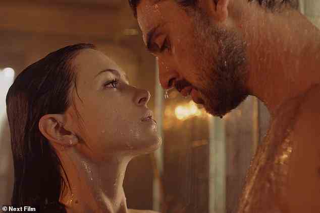 Adapted from Blanka Lipińska's book of the same name, the film follows a 'fiery executive' Laura Biel (played by Anna-Maria Sieklucka) as she is imprisoned by mafia boss Massimo Torricelli (Michele Morrone). Pictured, the pair in the shower