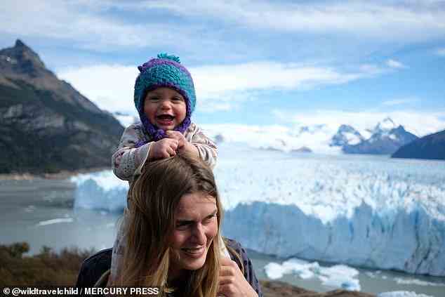 Chilling out: Baby Poppy enjoys seeing a glacier with her mum and dad visiting El Calafate in Argentina