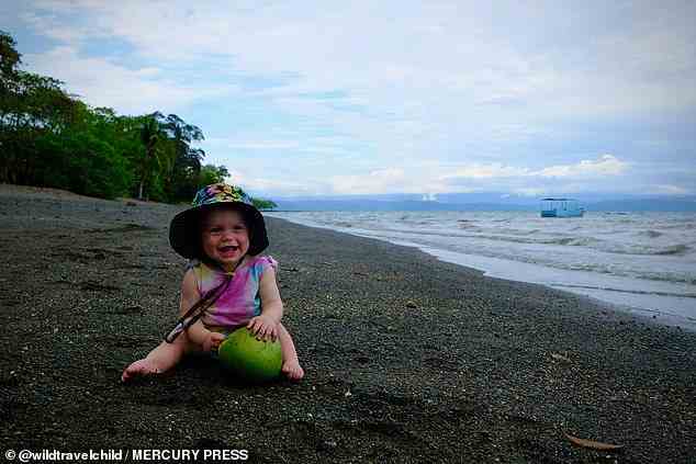 Beach time at - Corcovado National Park in Costa Rica: Most kids play with a bucket and spade, but Poppy makes do with whatever she can find