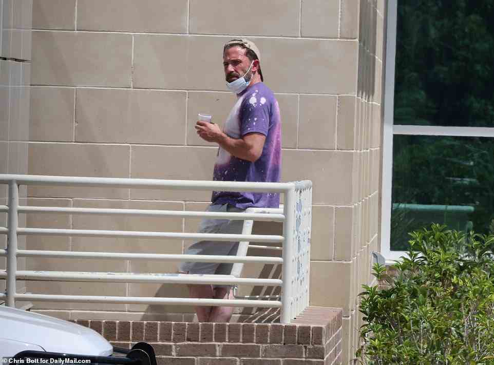 Ben could be seen outside the hospital sipping on a drink as he waited for his mother to be treated