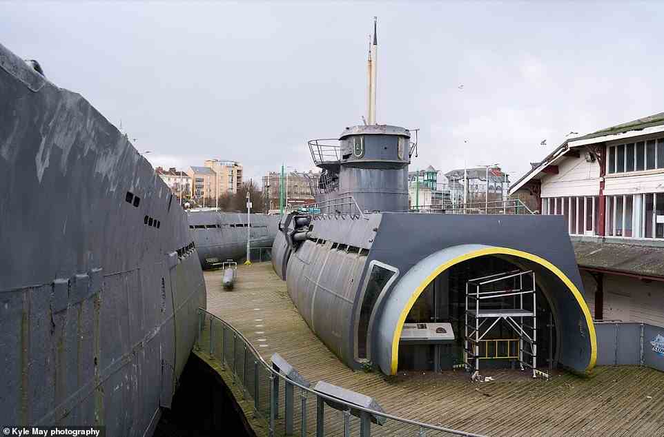 The U-boat was raised in 1993 and taken to Birkenhead, in Liverpool, where it went on display to the public at Woodside Ferry Terminal. Above: Sections of the vessel - which was cut up to aid its transportation - are seen above