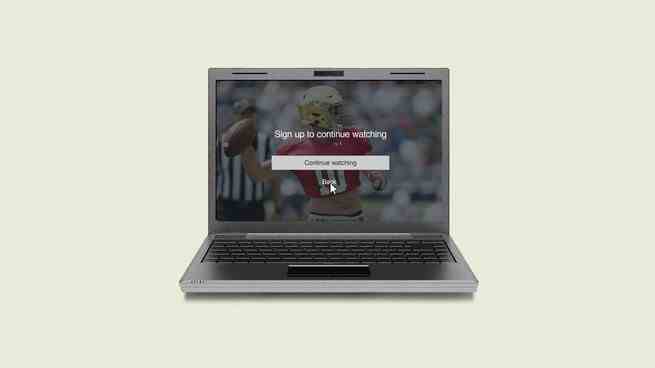 Ein Bild eines Laptops, das einen Fußballspieler zeigt, der mit dem Text überlagert ist "Melden Sie sich an, um weiter zu schauen."