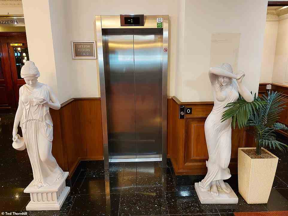 Plastic statues mark the entrance to one of the lifts in the Britannia lobby