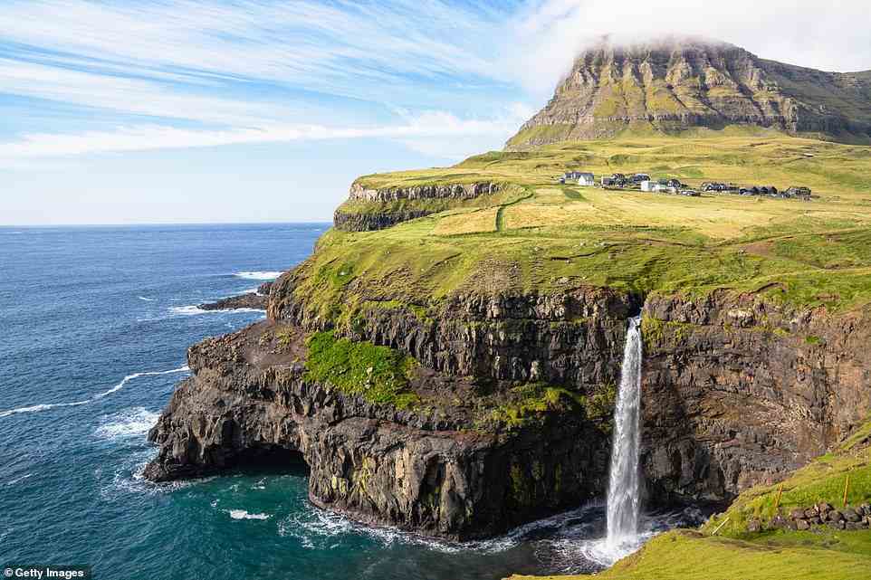 Majestic: Lucy Daltroff explored the Faroe Islands, an archipelago of 18 islands between Scotland and Iceland. Above is Mulafossur waterfall on the Faroese island of Vagar