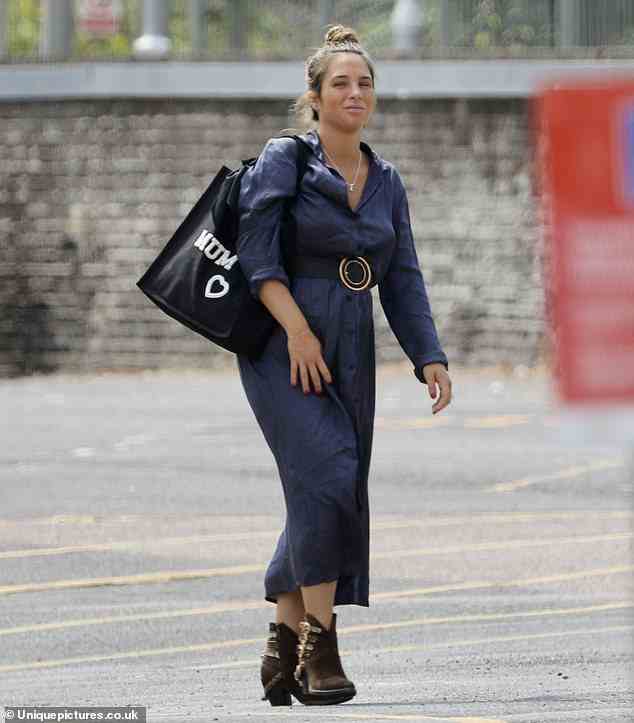 Mum's the word: Made In Chelsea star Maeva D'Ascanio carried an apt 'mum' slogan bag as she ran errands a world away from her usual SW3 stomping ground in Harlow, Essex, on Monday